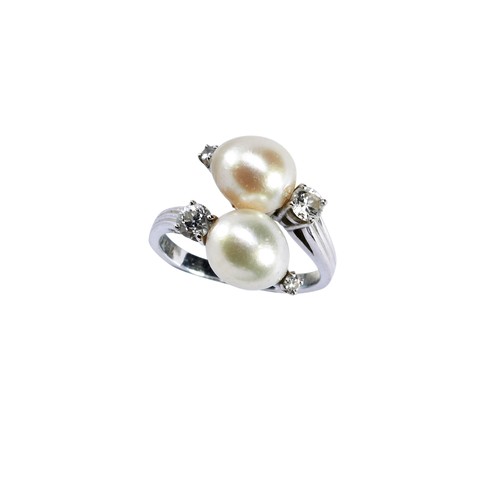 283 - GUBELIN; A CULTURED PEARL & DIAMOND RING two cultured pearls in a cross over setting, with claw ... 