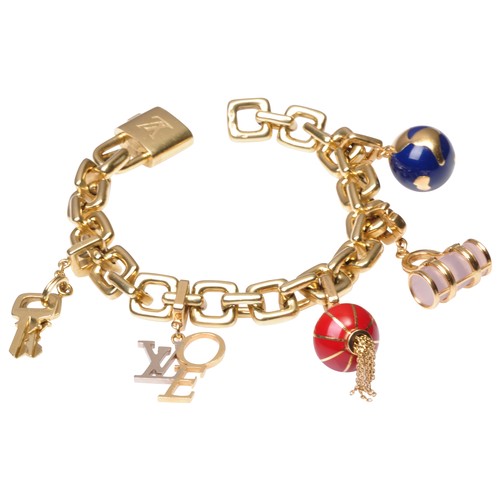 284 - LOUIS VUITTON; A GOLD AND ENAMEL CHARM BRACELETthe square link bracelet, suspending five charms, to ... 