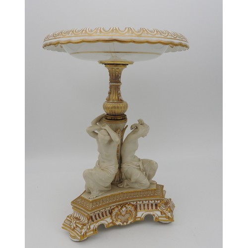 215 - A COPELAND PORCELAIN CENTREPIECE / COMPOTE, with a reticulated circular top supported by three kneel... 