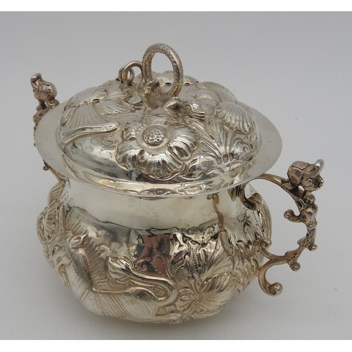 830 - A SILVER PORRINGER AND COVER, repousse decoration depicting a lion and unicorn amongst a profusion o... 