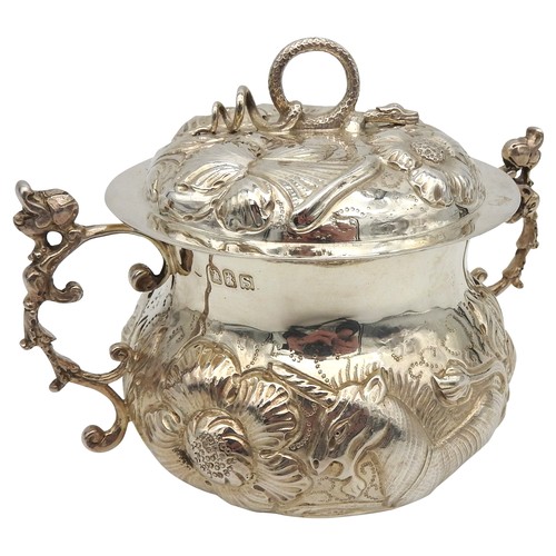 830 - A SILVER PORRINGER AND COVER, repousse decoration depicting a lion and unicorn amongst a profusion o... 