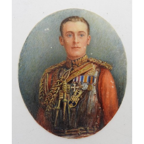 632 - AN EARLY 20TH CENTURY MINIATURE PORTRAIT WATERCOLOUR, on oval ivory panel, depicting highly decorate... 