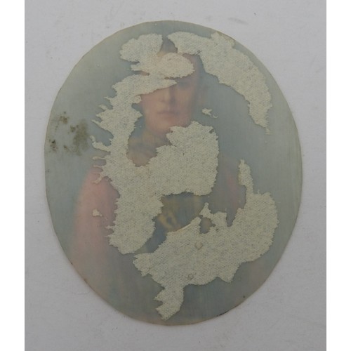 632 - AN EARLY 20TH CENTURY MINIATURE PORTRAIT WATERCOLOUR, on oval ivory panel, depicting highly decorate... 