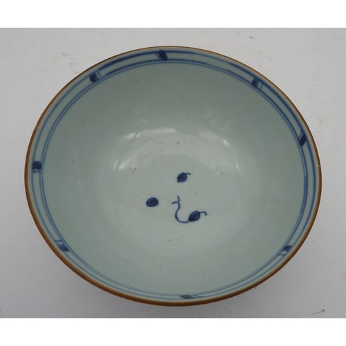 334 - A NANKING CARGO BLUE AND WHITE BOWL, CIRCA 1750, the sides decorated with a garden scene, with Chris... 