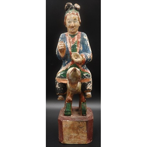 319 - AN CHINESE CARVED WOODEN POLYCHROME FIGURE, EARLY 20TH CENTURY, of a robed attendant holding a tea b... 