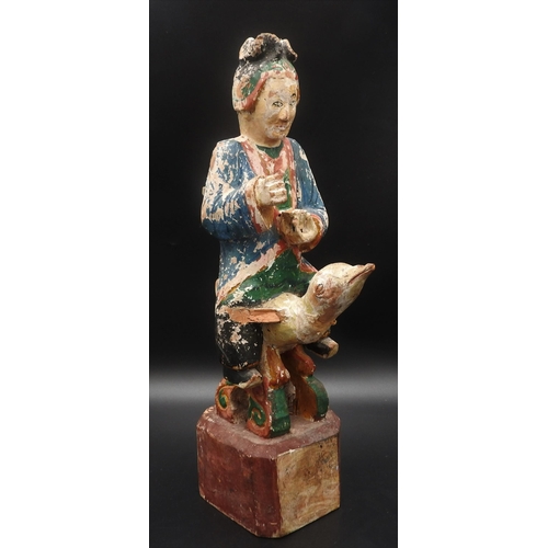 319 - AN CHINESE CARVED WOODEN POLYCHROME FIGURE, EARLY 20TH CENTURY, of a robed attendant holding a tea b... 