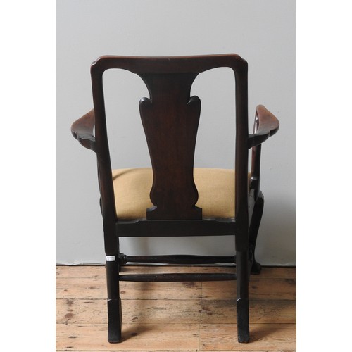 19 - A GEORGE II WALNUT ARMCHAIR, CIRCA 1740, straight top rail and vase form splat above a drop-in seat,... 