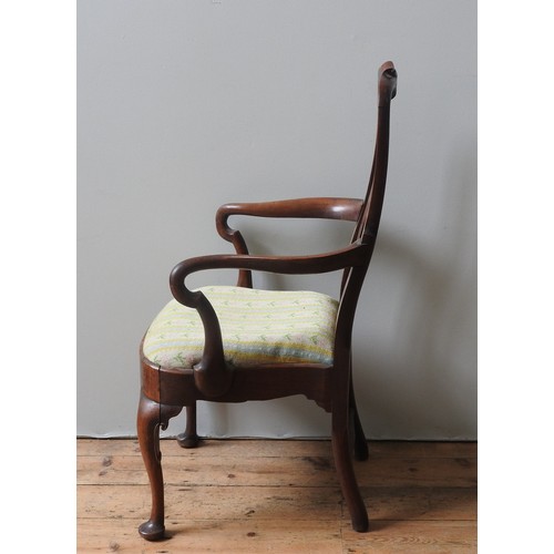 20 - A GEORGE II WALNUT ELBOW CHAIR, CIRCA 1740, curved top rail and vase form splat over a drop-in seat,... 