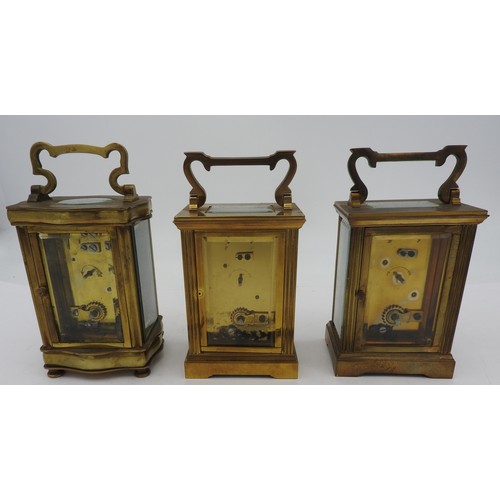 250 - A VINTAGE GARRARD BRASS CARRIAGE CLOCK AND TWO FRENCH CARRIAGE CLOCKS, all with keys11 cm high max... 