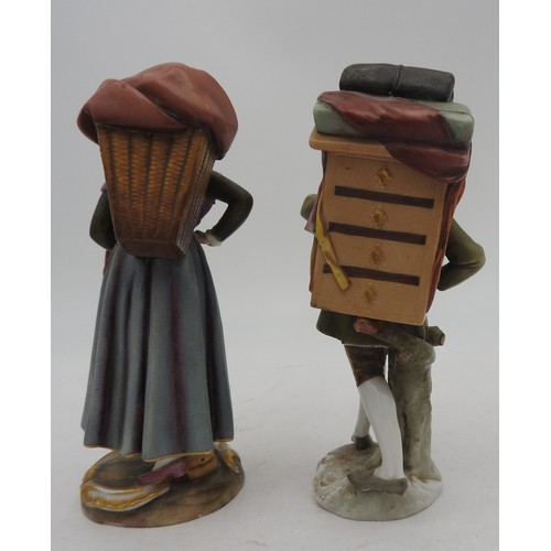 212 - A MATCHED PAIR OF VOLKSTEDT PORCELAIN FIGURES, EARLY 20TH CENTURY, of lady and gent travellers carry... 