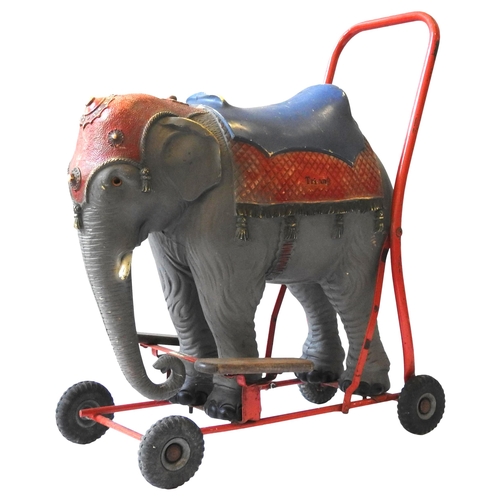 A VINTAGE TRI ANG RIDE ON PUSH ALONG ELEPHANT CIRCA 1960 naturalistic model mounted on a tubular