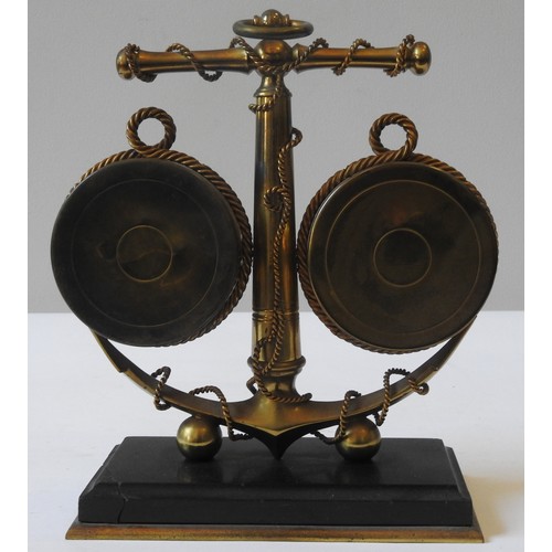 243 - A MARITIME THEMED CLOCK/BAROMETER DESK COMPENDIUM, the anchor shaped support flanked by a clock and ... 