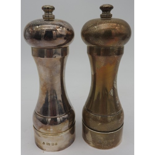 826 - A SILVER PEPPER MILL, London 1987 and another, London 1988, boxed.
15cm high