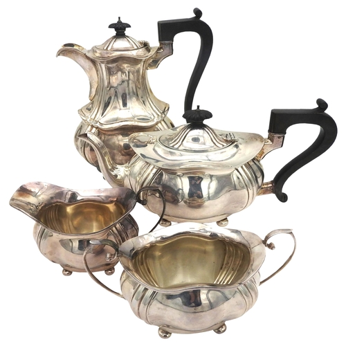 849 - A FOUR PIECE SILVER TEA SET, of ribbed bombe form, marked Birmingham 1960.The hot water jug 22 cm hi... 