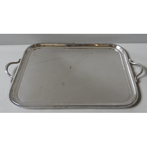 832 - A LARGE ATKIN Bros. SILVER PLATED SALVER with reeded border. 56 x 43 cms