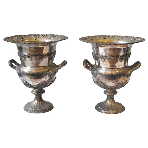 833 - A PAIR OF SILVER PLATED CAMPANA FORM URN WINE COOLERS,20th century35 cm high x 30cm diameter... 