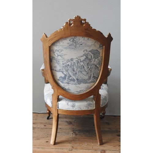 92 - A LOUIS XV STYLE GILTWOOD UPHOLSTERED FAUTEIUL, CIRCA 1900, foliate carved arch top rail with centra... 