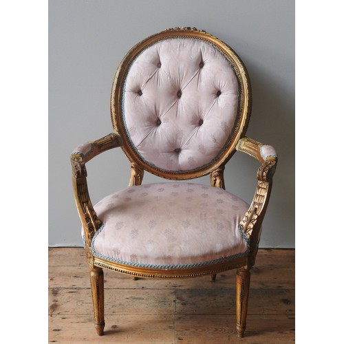 98 - A LOUIS XVI STYLE GILT WOOD FAUTEUIL, 19TH CENTURY, button upholstered pale pink Damask back and sea... 