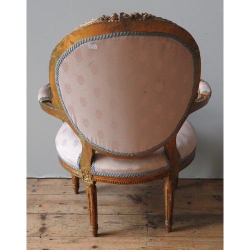 98 - A LOUIS XVI STYLE GILT WOOD FAUTEUIL, 19TH CENTURY, button upholstered pale pink Damask back and sea... 