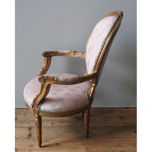 98 - A LOUIS XVI STYLE GILT WOOD FAUTEUIL, 19TH CENTURY, button upholstered pale pink Damask back and sea... 