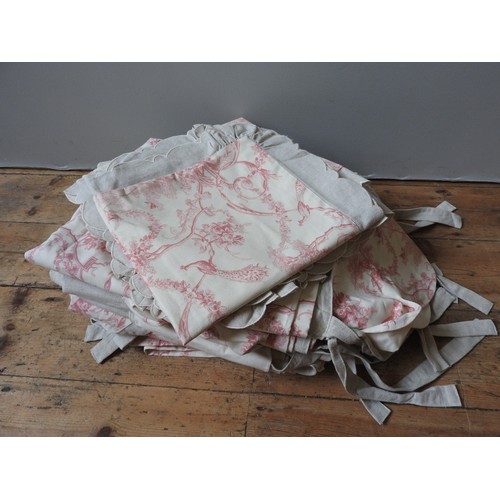 162 - THREE PAIRS OF RED AND CREAM TOILE DE JOUY DRAPES, together with six matching cushion covers.