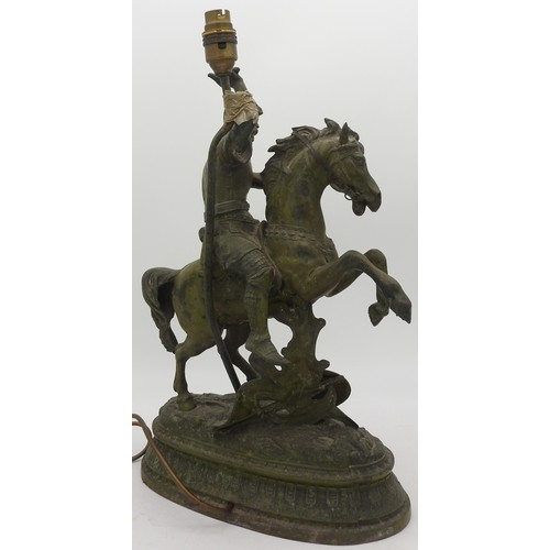 131 - A CAST SPELTER FIGURAL TABLE LAMP, CIRCA 1900, depicting a knight in armour on horseback50 cm (inclu... 