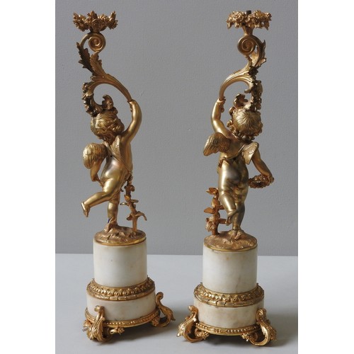 142 - A PAIR OF LOUIS XV STYLE GILT BRONZE AND MARBLE FIGURAL LAMP BASES, 19TH CENTURY, the columns formed... 