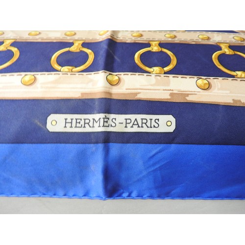 659 - TWO HERMES SILK SCARVES, comprising a blue ground 'Aux Champs', original design by Cathy Latham in t... 