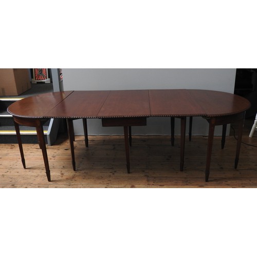 82 - A REGENCY MAHOGANY DINING ROOM TABLE WITH CENTRAL DROP FLAP SECTION AND TWO 'D' ENDS, THE WHOLE WITH... 