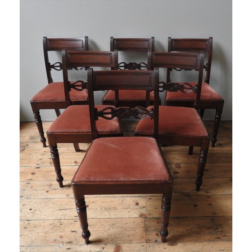 83 - A SET OF SIX REGENCY MAHOGANY DINING CHAIRS, WITH FLORAL AND LYRE CARVED CROSS BACK, DROP IN SEAT AN... 