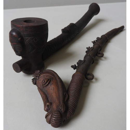 314 - TWO OPIUM PIPES, 19TH/20TH CENTURY, one carved hardwood example with twin mask decorated bowl, one c... 