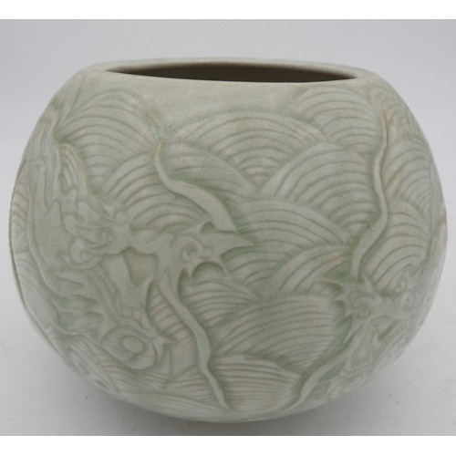 307 - A CHINESE CARVED CELADON 'DRAGON' JARLATE QING / REPUBLIC PERIODthe sides carved with two confrontin... 