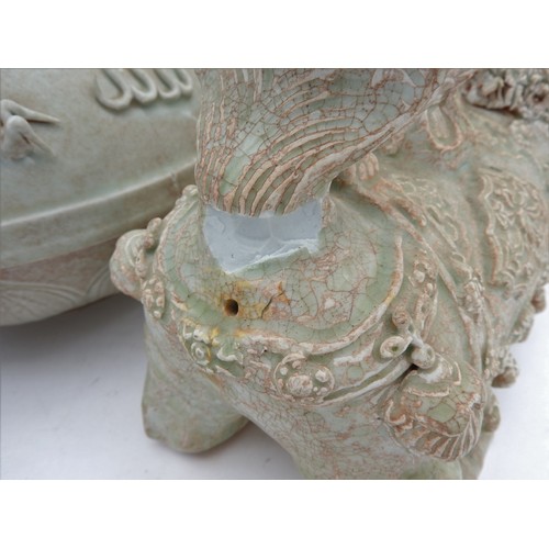 291 - A PAIR OF CHINESE CELADON-GLAZED BUDDHIST LIONS20TH CENTURY15cm high; together with A CELADON-GLAZED... 