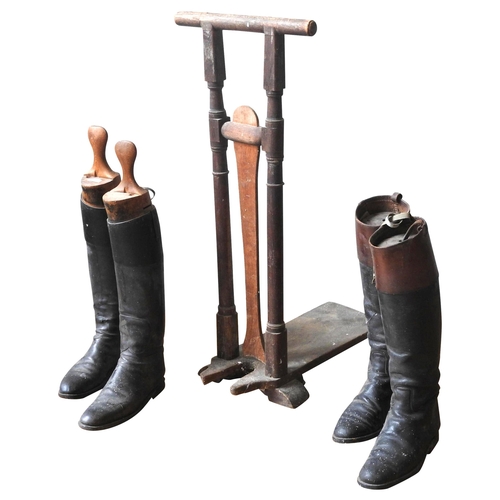 646 - A PINE UPRIGHT BOOT JACK, 19TH CENTURY, WITH TWO PAIRS OF LEATHER RIDING BOOTS AND BOOT TREES, the b... 