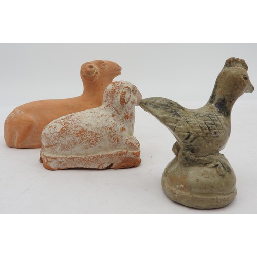 338 - A GROUP OF THREE CHINESE POTTERY ANIMAL MODELS, the lot comprised of a terracotta ram, a cream paint... 