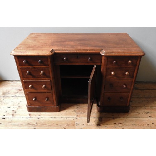 74 - A VICTORIAN MAHOGANY WRITING DESK, CIRCA 1870, breakfront rectangular top with moulded edge above a ... 