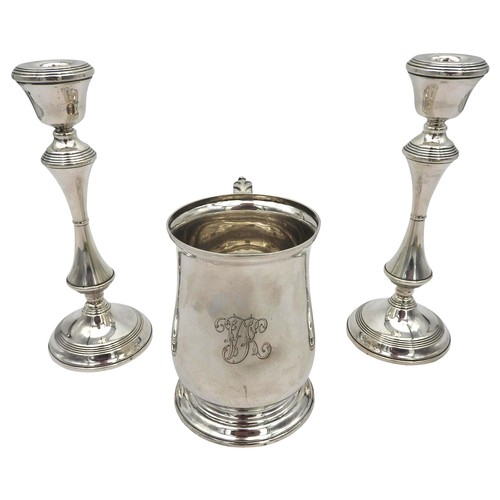 834 - A SILVER TANKARD AND A PAIR OF WEIGHTED SILVER CANDLESTICKS, the wide waisted tankard with engraved ... 