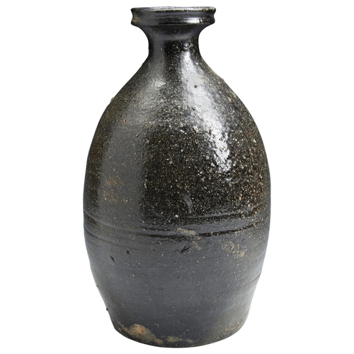 509 - A KOREAN KURO-GORAI STONEWARE VASEGOREYEO PERIOD the baluster sidess covered in a thick blackish / b... 