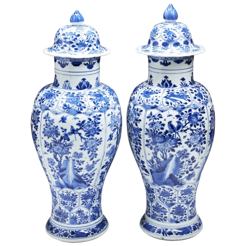 A PAIR OF OF BLUE AND WHITE COVERED BALUSTER VASES