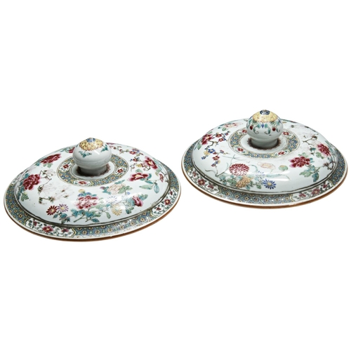 239 - A LARGE PAIR OF FAMILLE ROSE JAR COVERS QIANLONG PERIOD (1736-1795)painted in coloured enamels with ... 