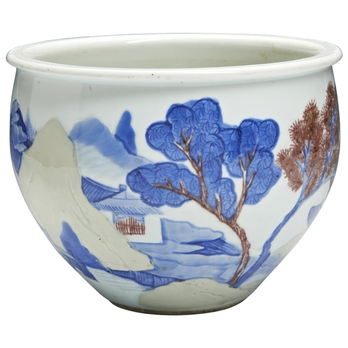 240 - AN UNDERGLAZE BLUE COPPER-RED AND CELADON-GLAZED 'LANDSCAPE' JARDINIERE KANGXI PERIOD (1662-1722)the... 