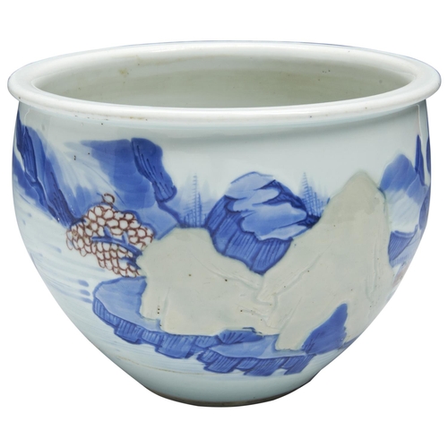 240 - AN UNDERGLAZE BLUE COPPER-RED AND CELADON-GLAZED 'LANDSCAPE' JARDINIERE KANGXI PERIOD (1662-1722)the... 