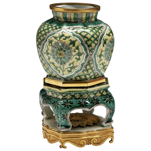 247 - A RARE FAMILLE JUANE JAR ON STANDKANGXI PERIOD (1662-1722)of hexagonal form, the facetted sides pain... 