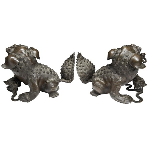 111 - A LARGE PAIR OF BRONZE BUDDHIST LIONS MING DYNASTY (1368-1644)the male and female lions cast with fl... 