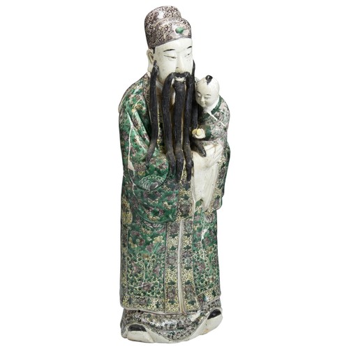 241 - LARGE FAMILLE VERTE FIGURE OF IMMORTAL HOLDING A BOYQING DYNASTY, 19TH CENTURYthe standing figure we... 