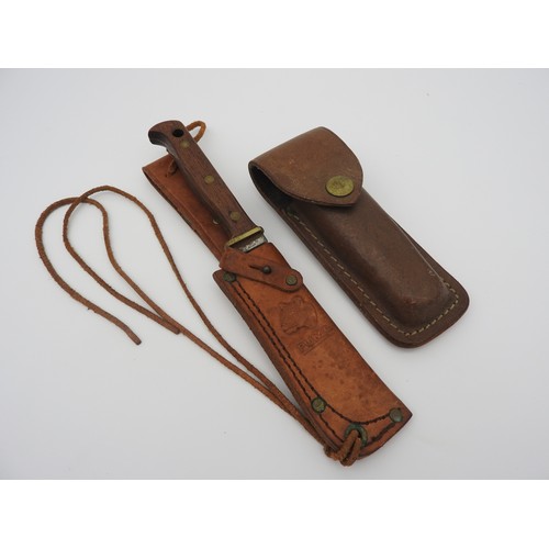 A VINTAGE PUMA KNIFE WITH EMBOSSED SHEATH and marked Germany