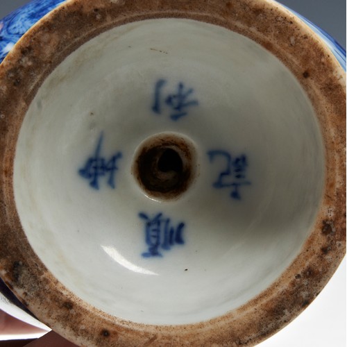 179 - A BLUE AND WHITE CADOGAN TEAPOTLATE QING DYNASTYthe sides painted with a mountainous landscape view,... 