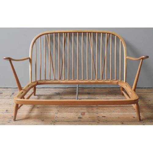 88 - AN ERCOL 'WINDSOR' SETTEE FRAME AND TWO ARMCHAIR FRAMES, CIRCA 1960, constructed from beech and elm,... 