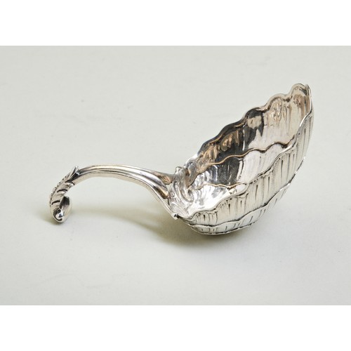 4 - A SHELL BOWL CADDY SPOON, POSSIBLY DUTCH C.1770. A rather large caddy spoon with a curved acanthus s... 