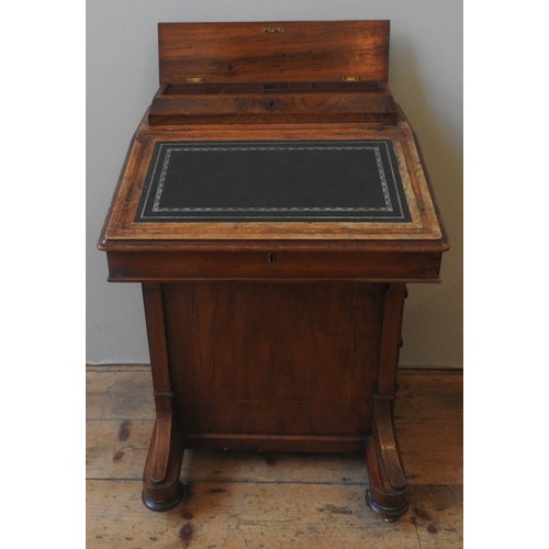 50 - A LATE VICTORIAN WALNUT DAVENPORT, CIRCA 1875, the hinged cover inset with gilt tooled leather panel... 